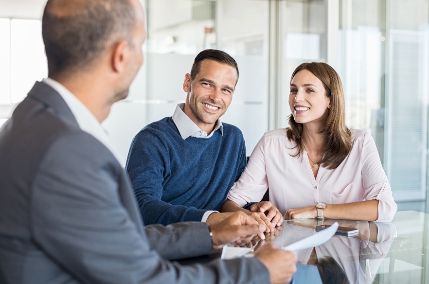 couple meeting with insurance agent