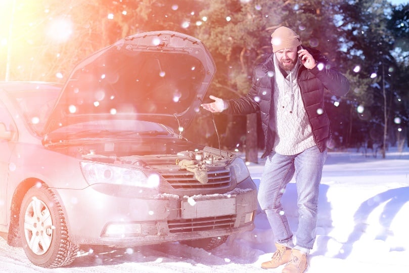 broken down car in the snow