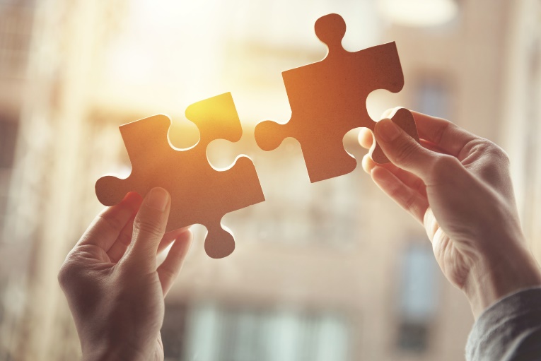 putting two puzzle pieces together